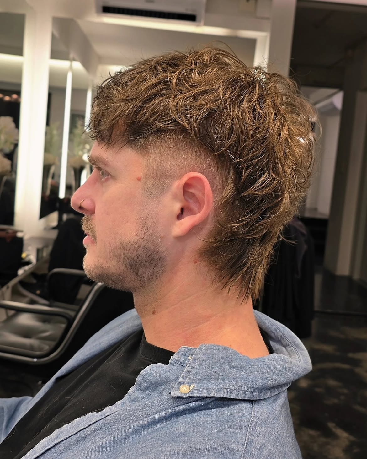 6. Curly Taper Fade Mullet