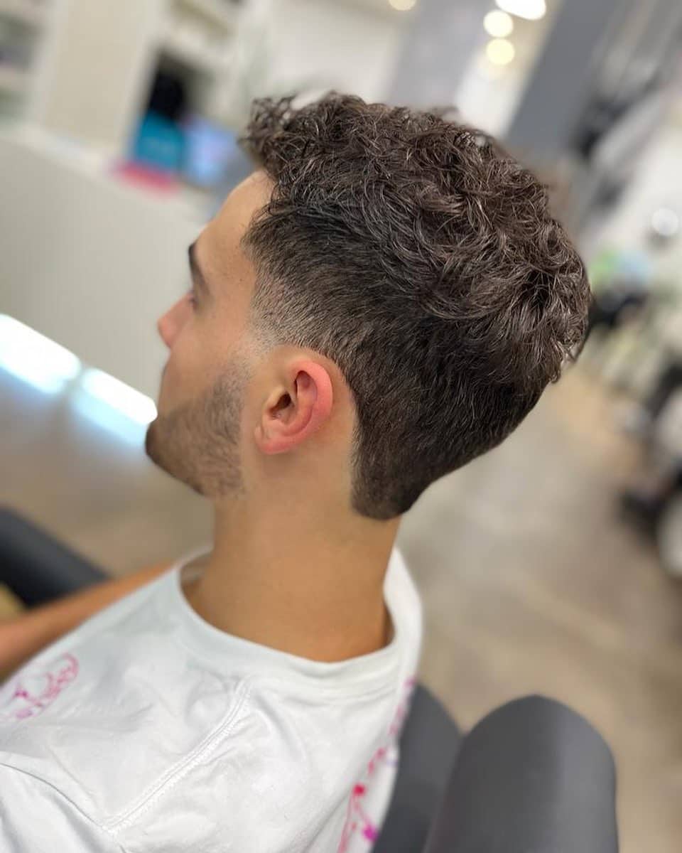 26. Curly Tapered Mini Mullet