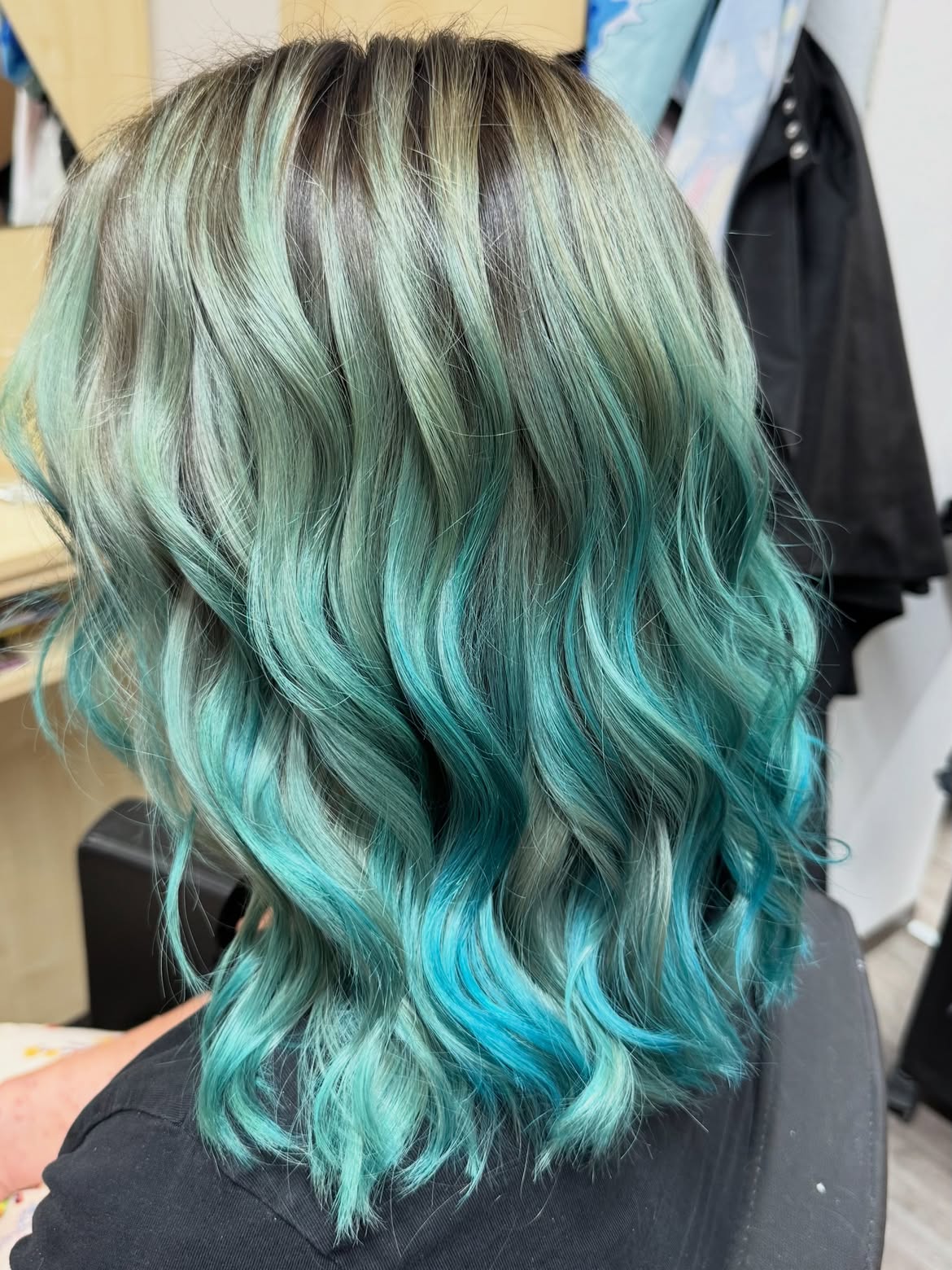 24. Dark Roots with Bright Aqua Dip Dye