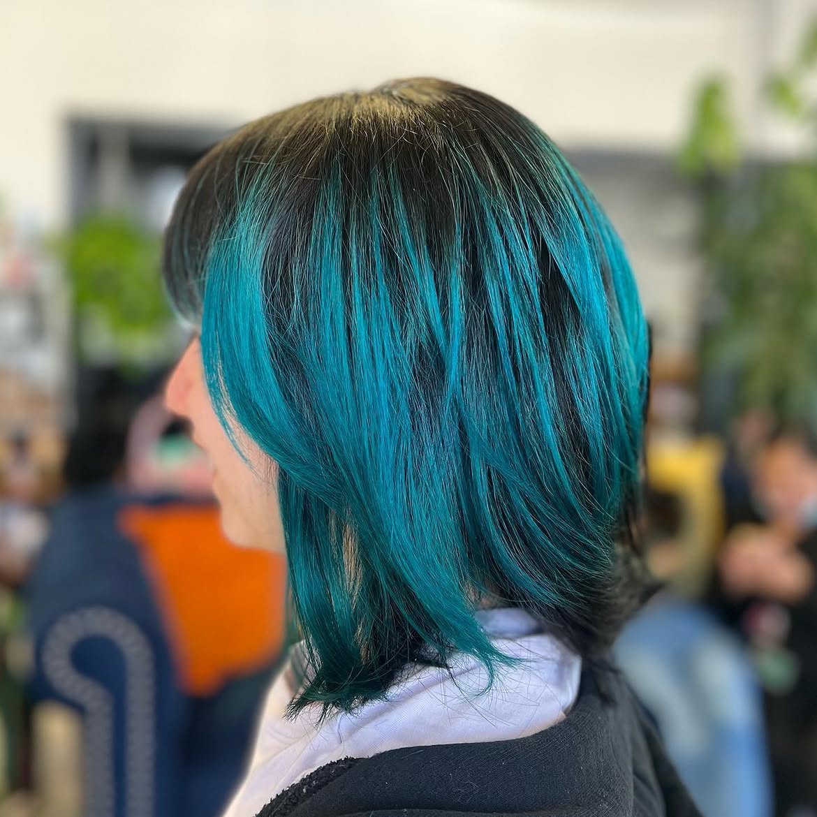 2. Dark Roots with Electric Teal Highlights