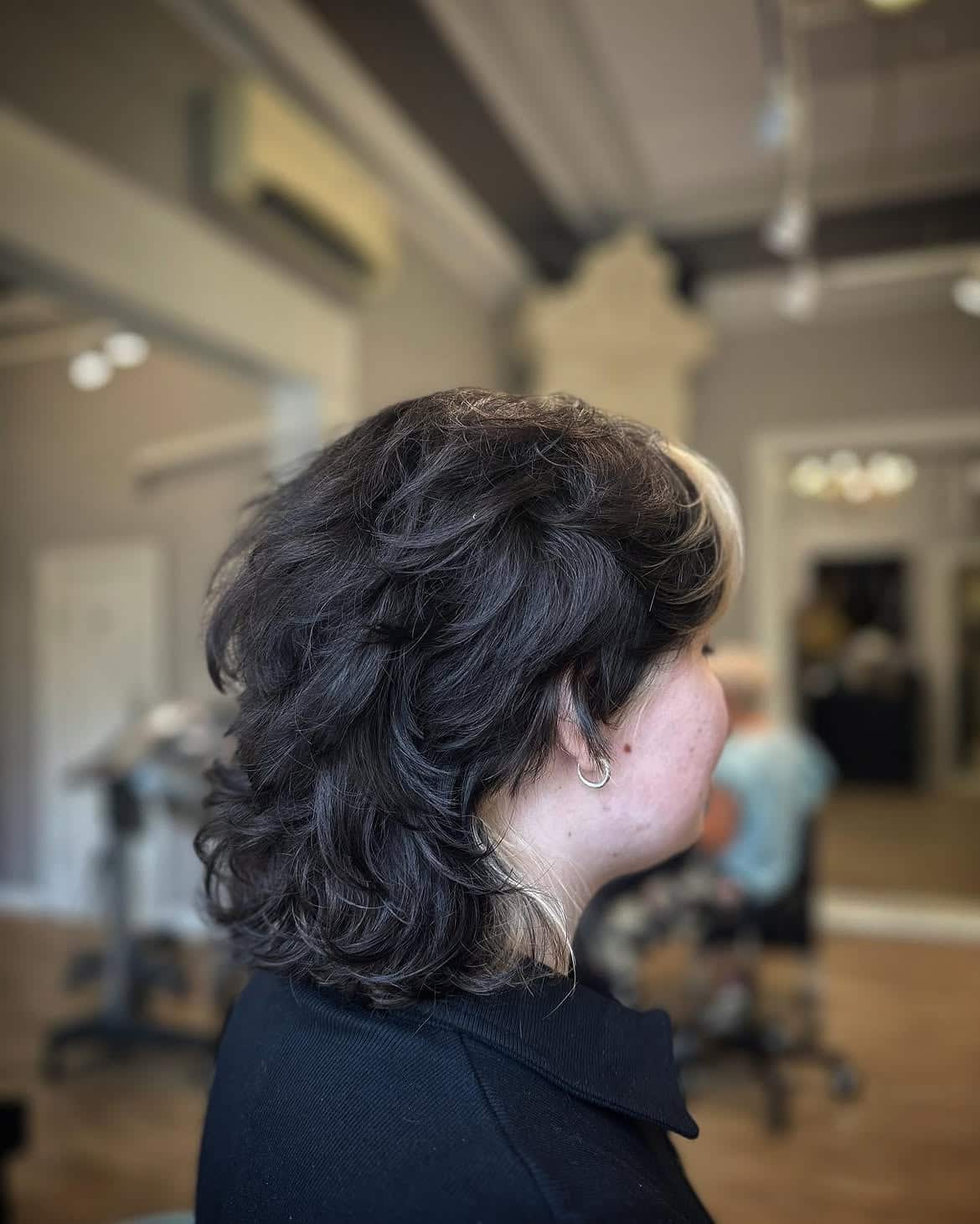 33. Dark Shaggy Mullet with Blonde Face-Framing Piece