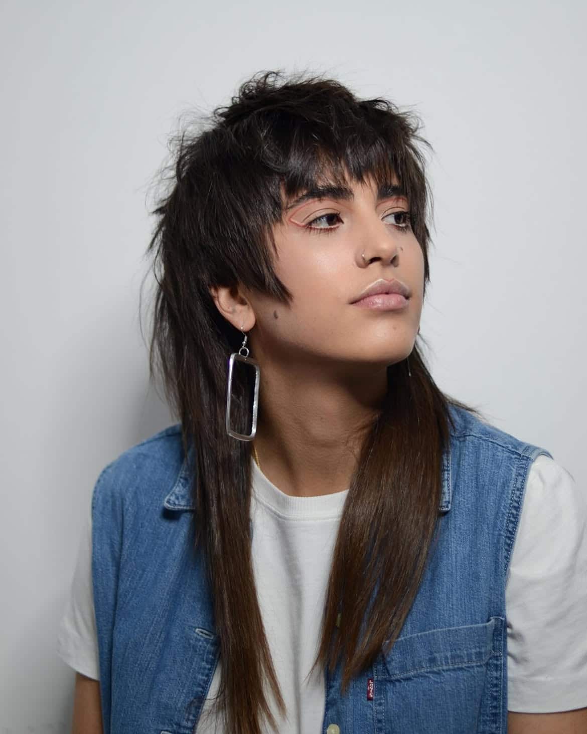 9. Dark and Disconnected Shag Mullet