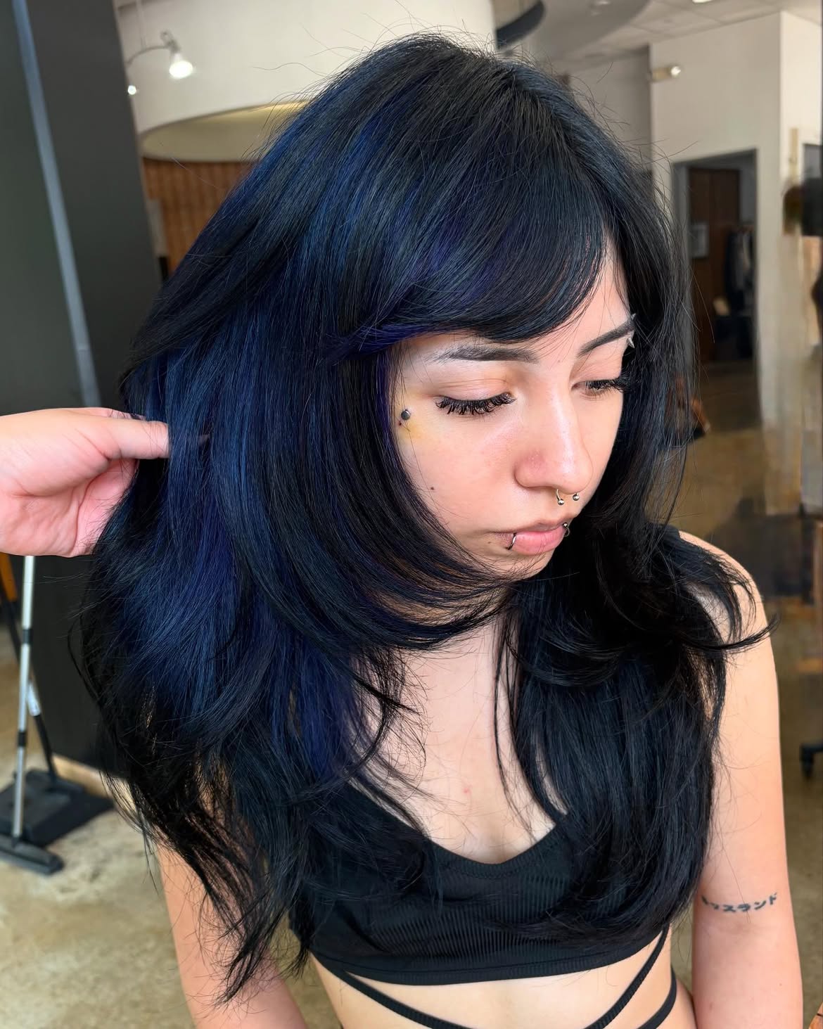 7. Deep Blue Layers with Soft Curtain Bangs