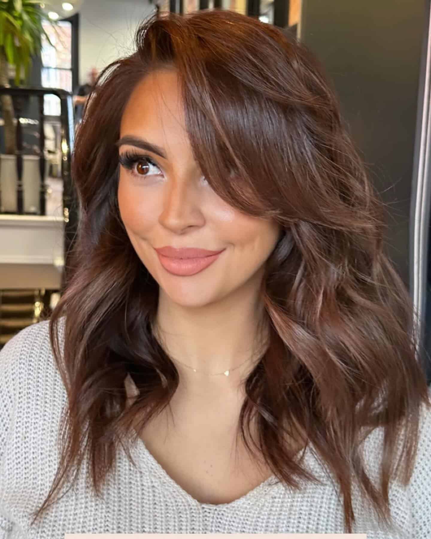 23. Deep Chestnut Side-Swept Curls