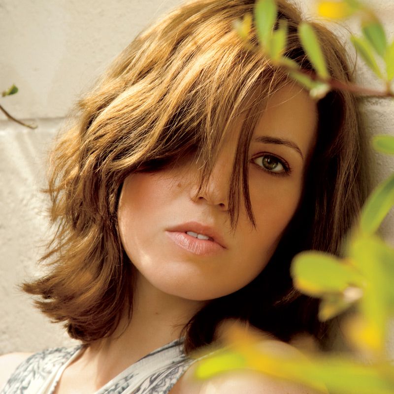 11. Deep Side Part with Tousled Layers