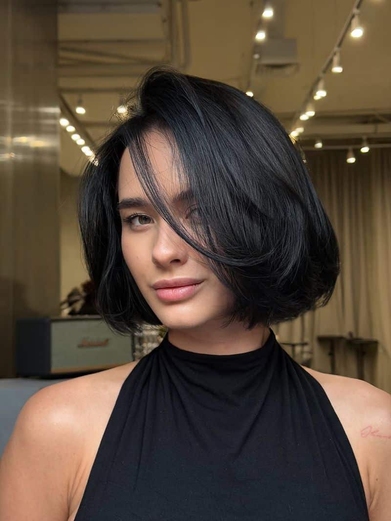 11. Deep Side-Parted Chin-Length Bob