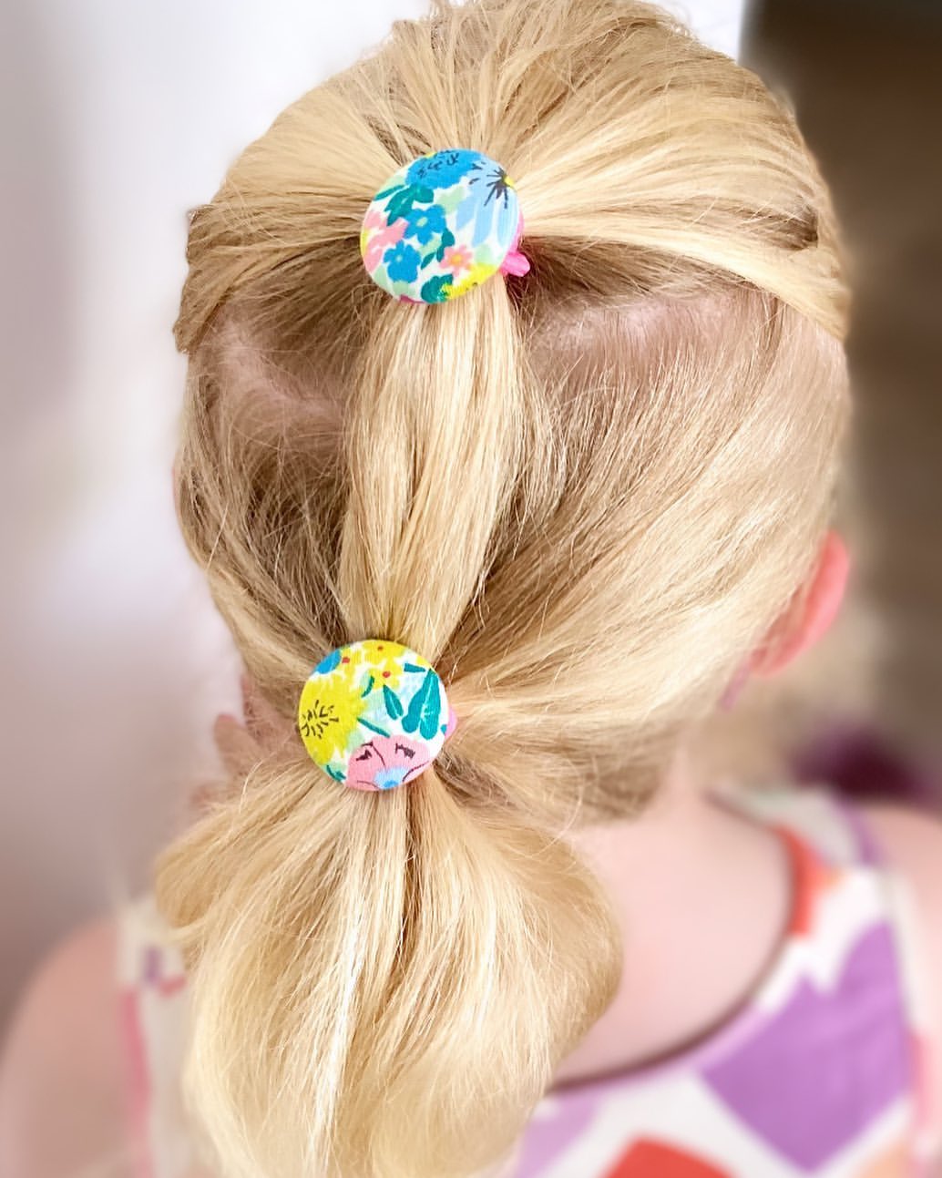 19. Double Ponytail with Floral Fabric Elastics