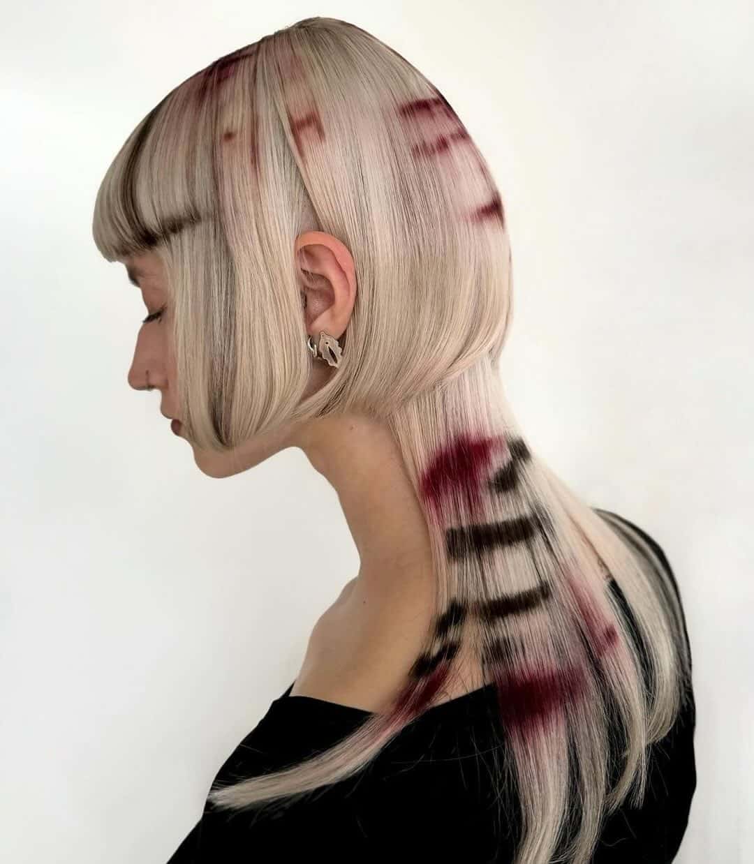 43. Edgy Blonde with Bold Streaks