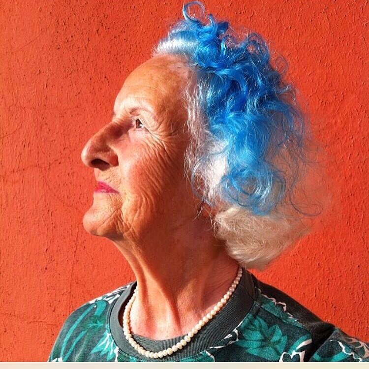 23. Electric Blue Curls on Silver Hair