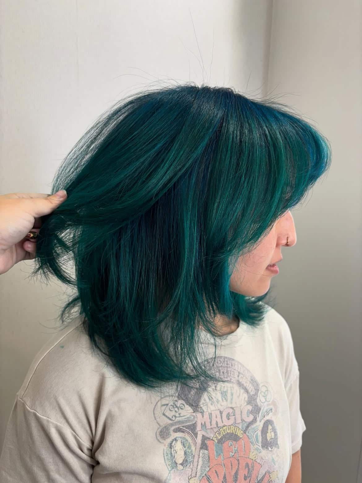 11. Emerald Shag with Curtain Bangs