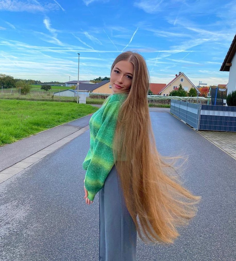7. Extra-Long Honey Blonde Hair with a Center Part