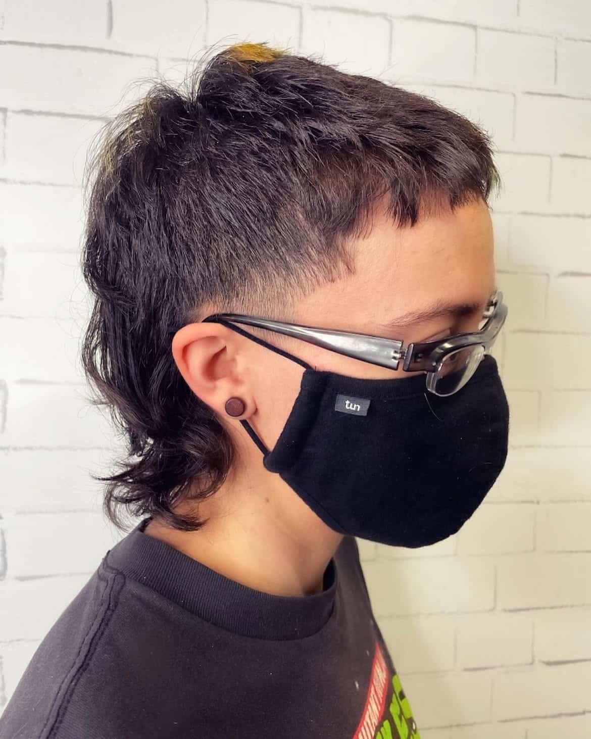 24. Fade Undercut Mullet with Baby Bangs