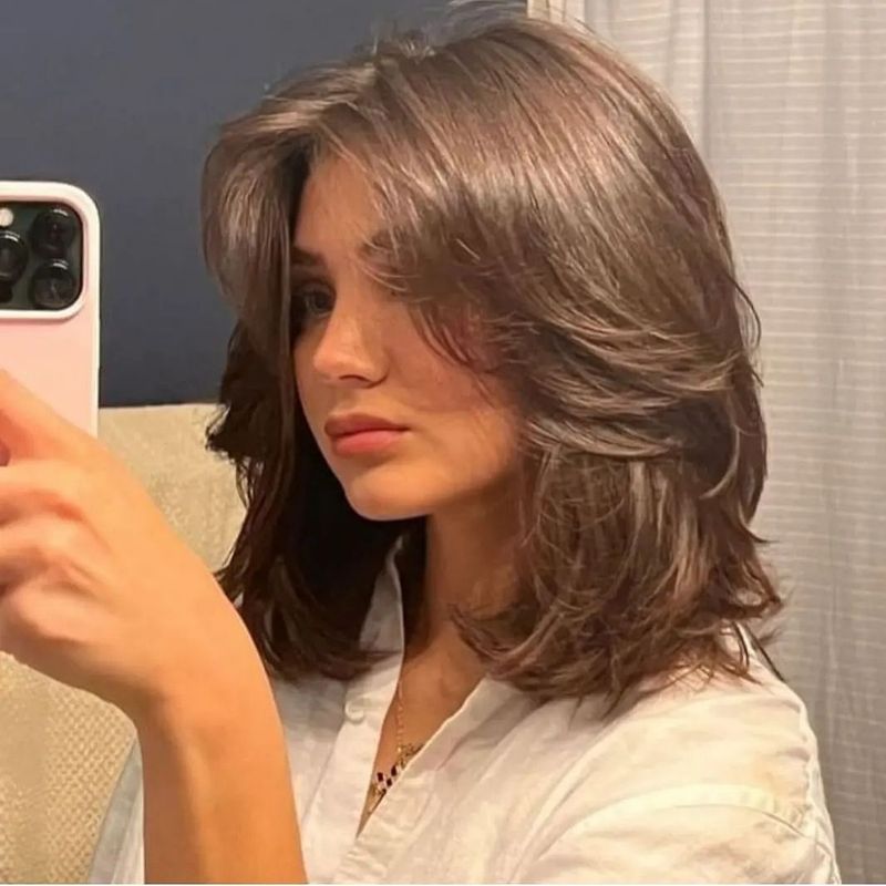 55. Feathered Brown Lob with Curtain Bangs