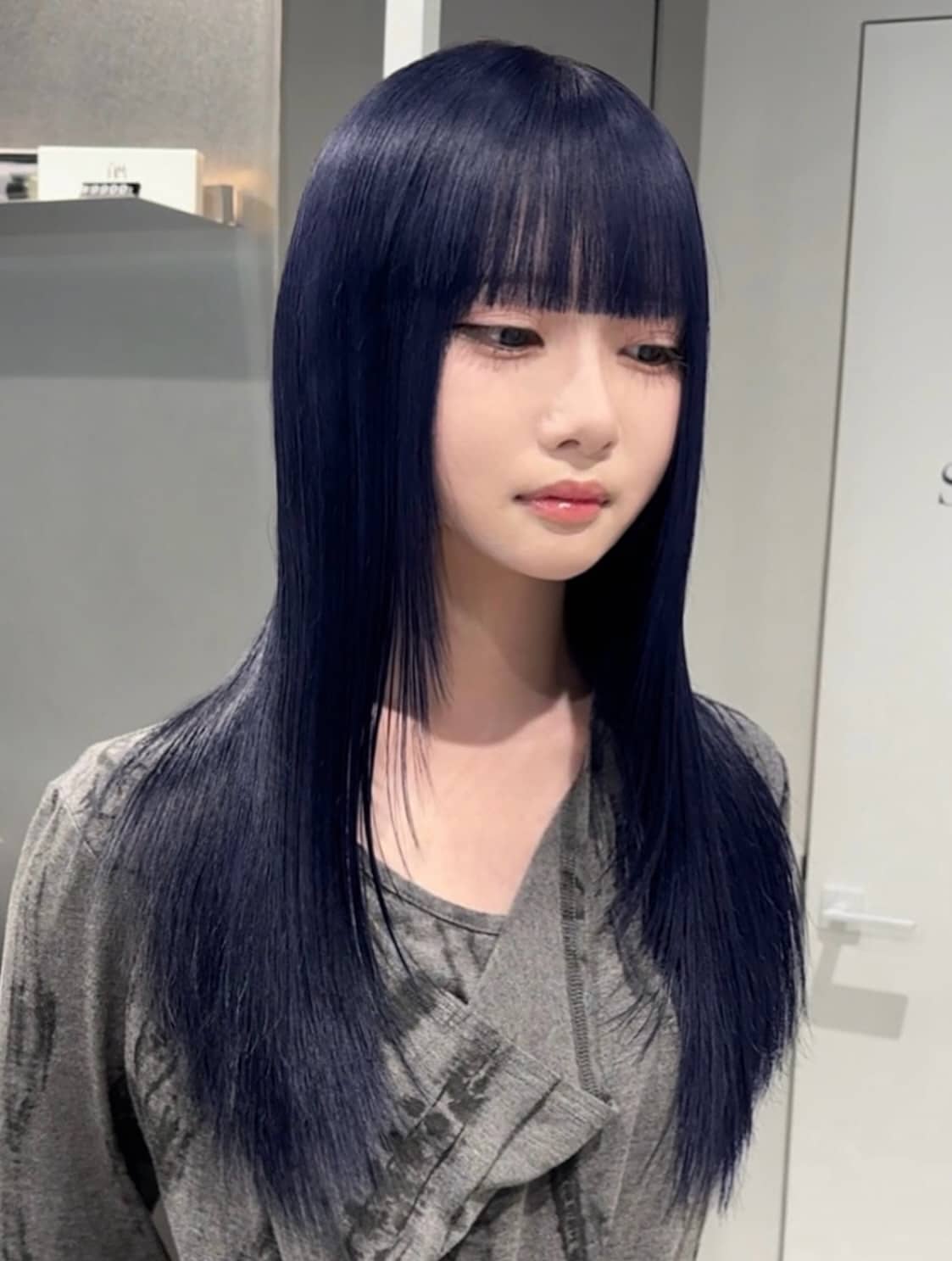 11. Glass-Straight Midnight Layers with Wispy Fringe