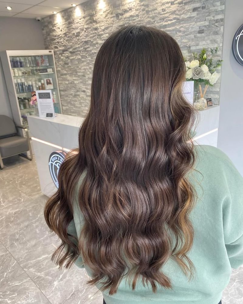 20. Glossy Long Waves with Caramel Highlights