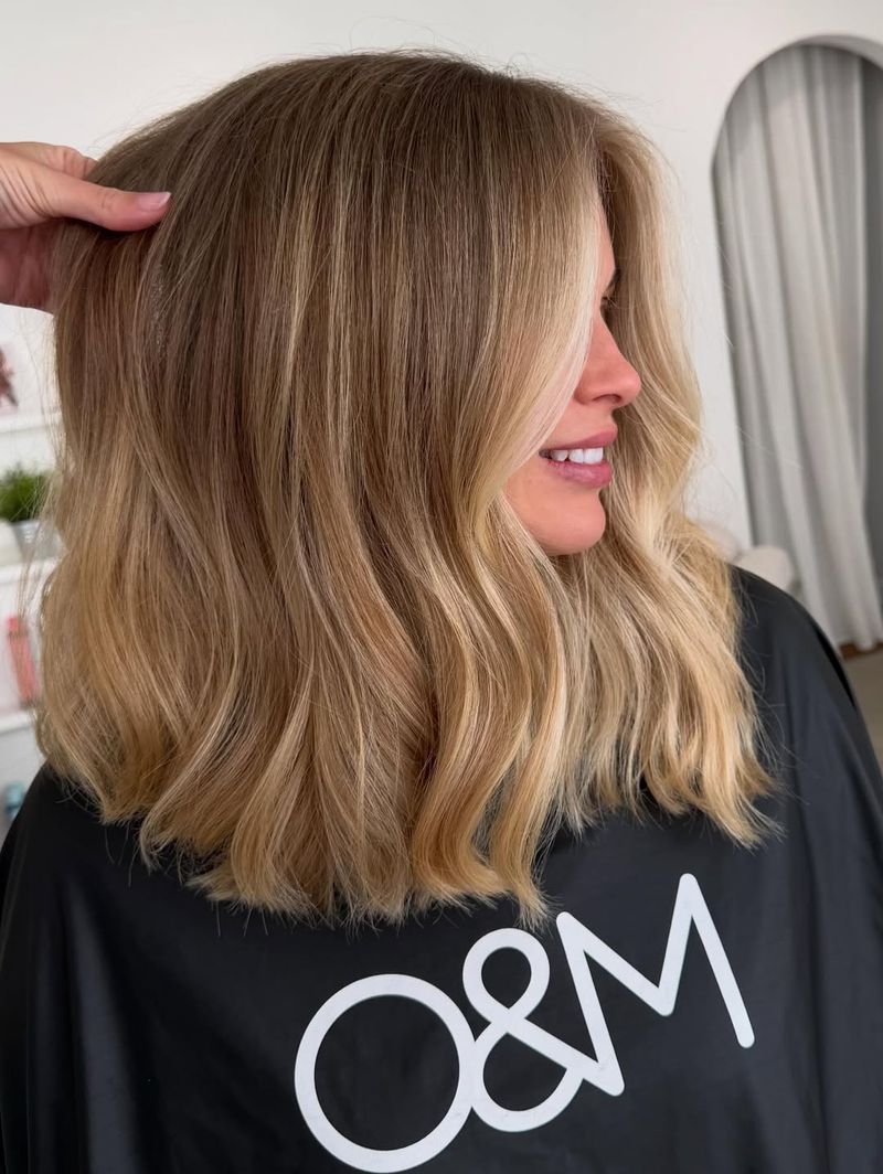 59. Golden Balayage Lob with Face-Framing Highlights