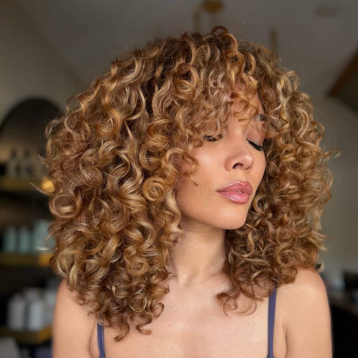48. Golden Curls with Curly Bangs