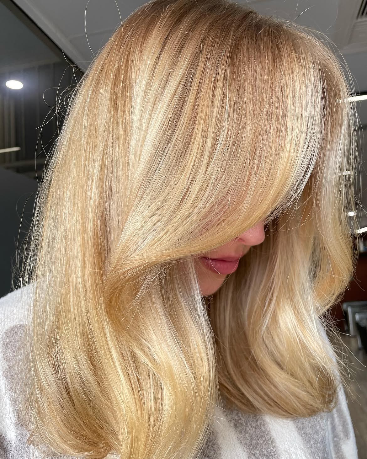 3. Golden Curtain Bangs and Soft Layers