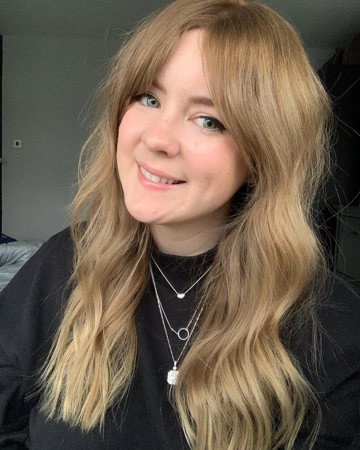 2. Golden Curtain Bangs and Waves