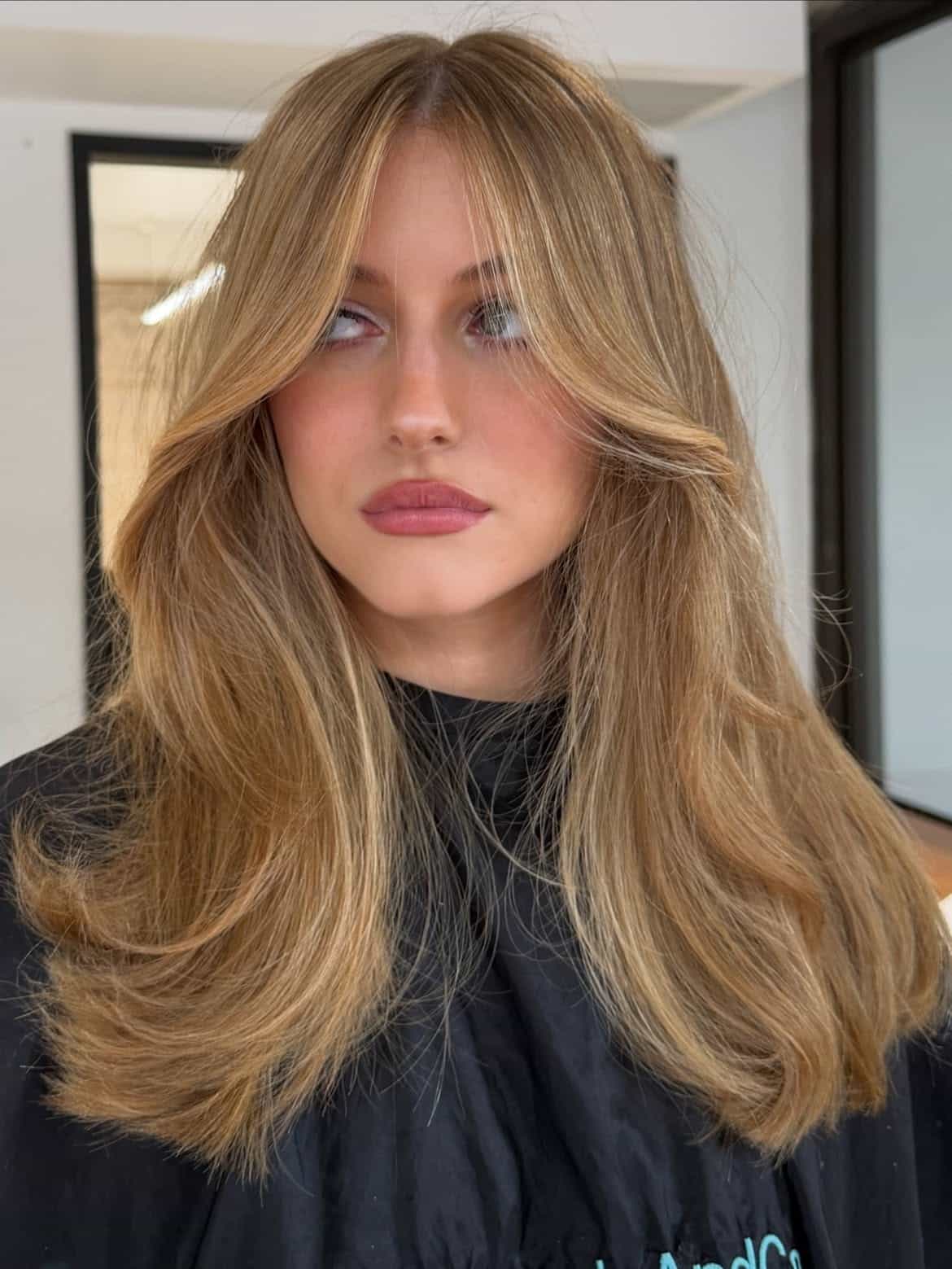 27. Golden Curtain Bangs with Blowout Layers