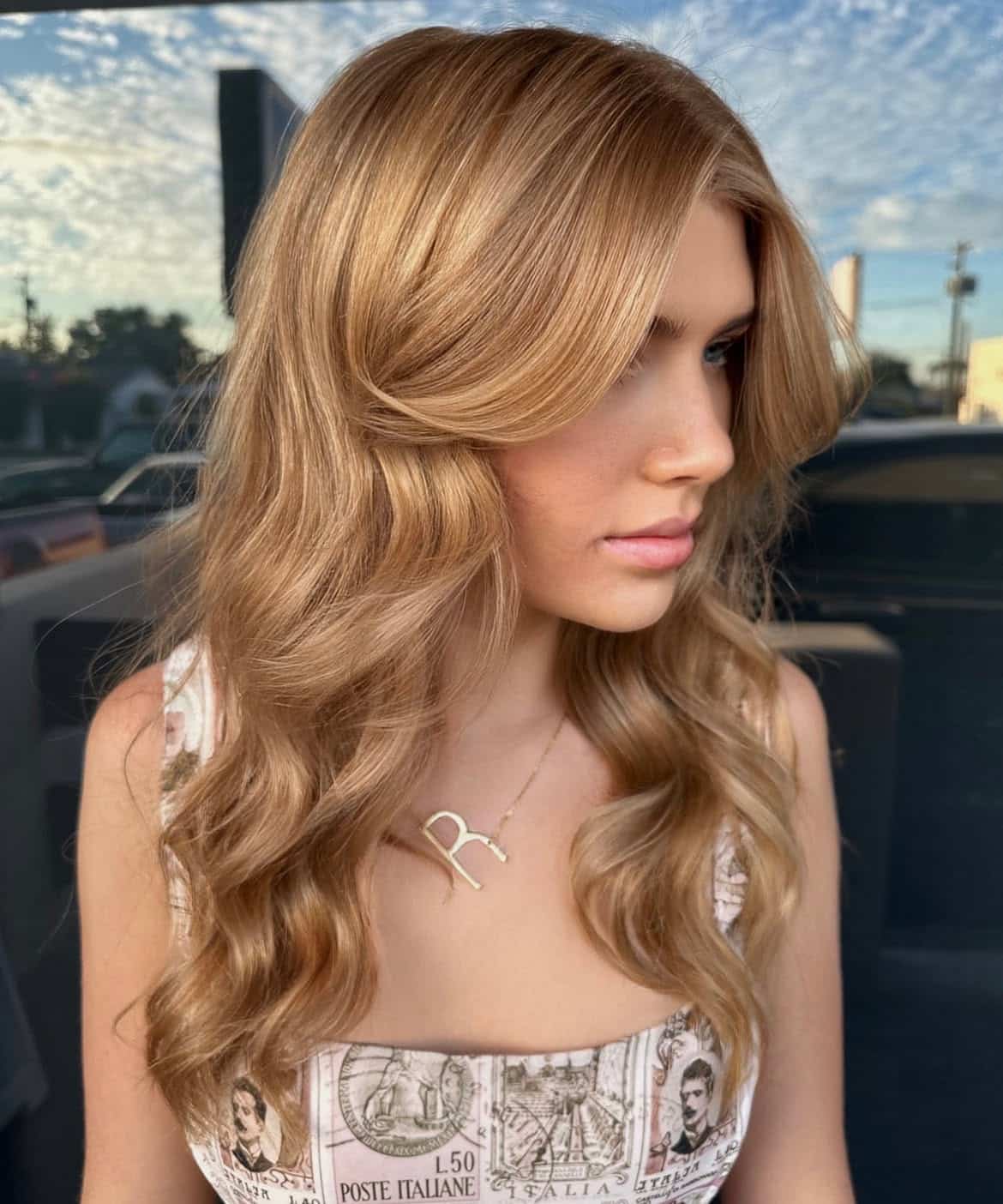 17. Golden Honey Waves with Curtain Bangs