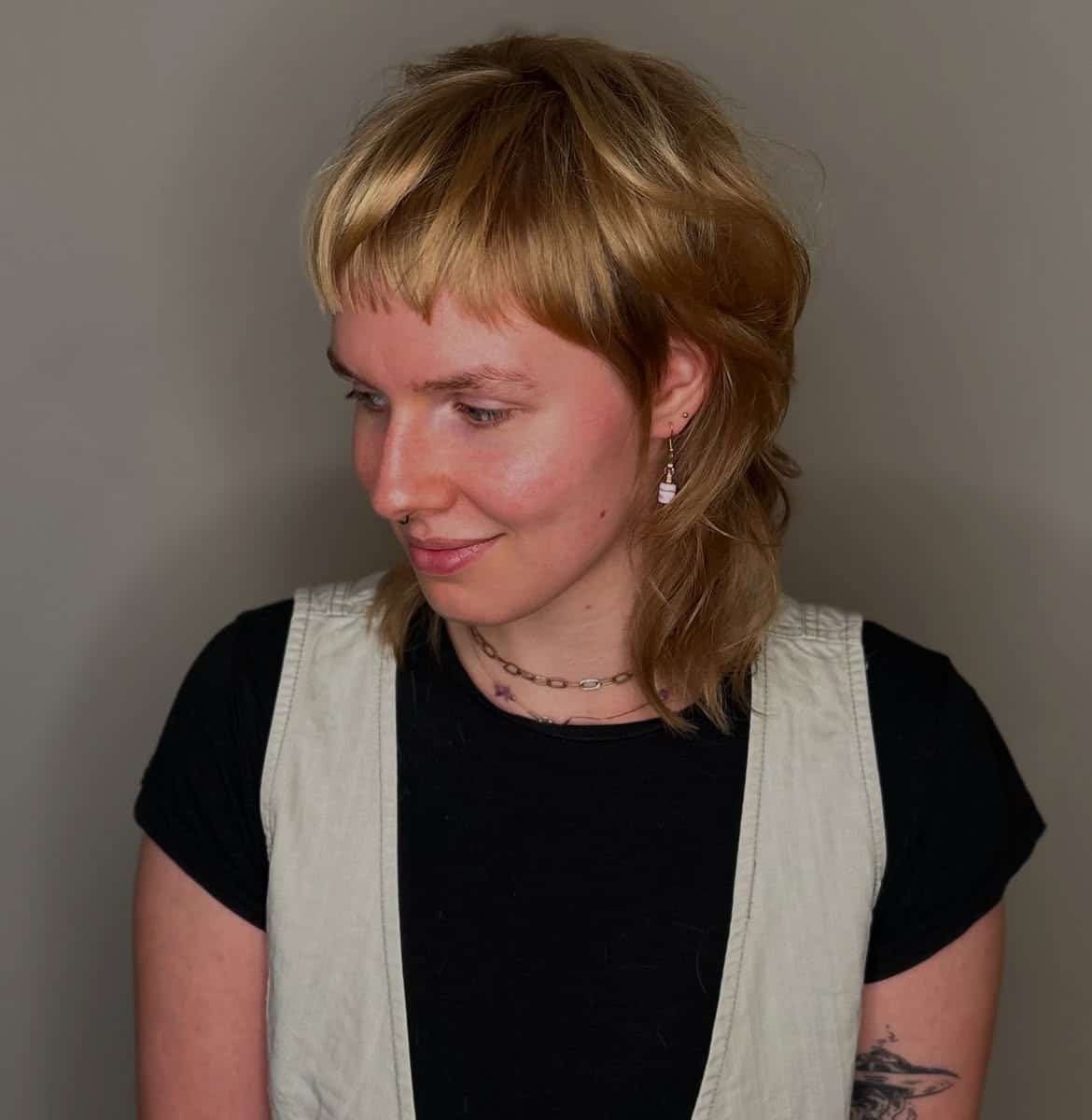 6. Golden Shag Mullet with Baby Bangs