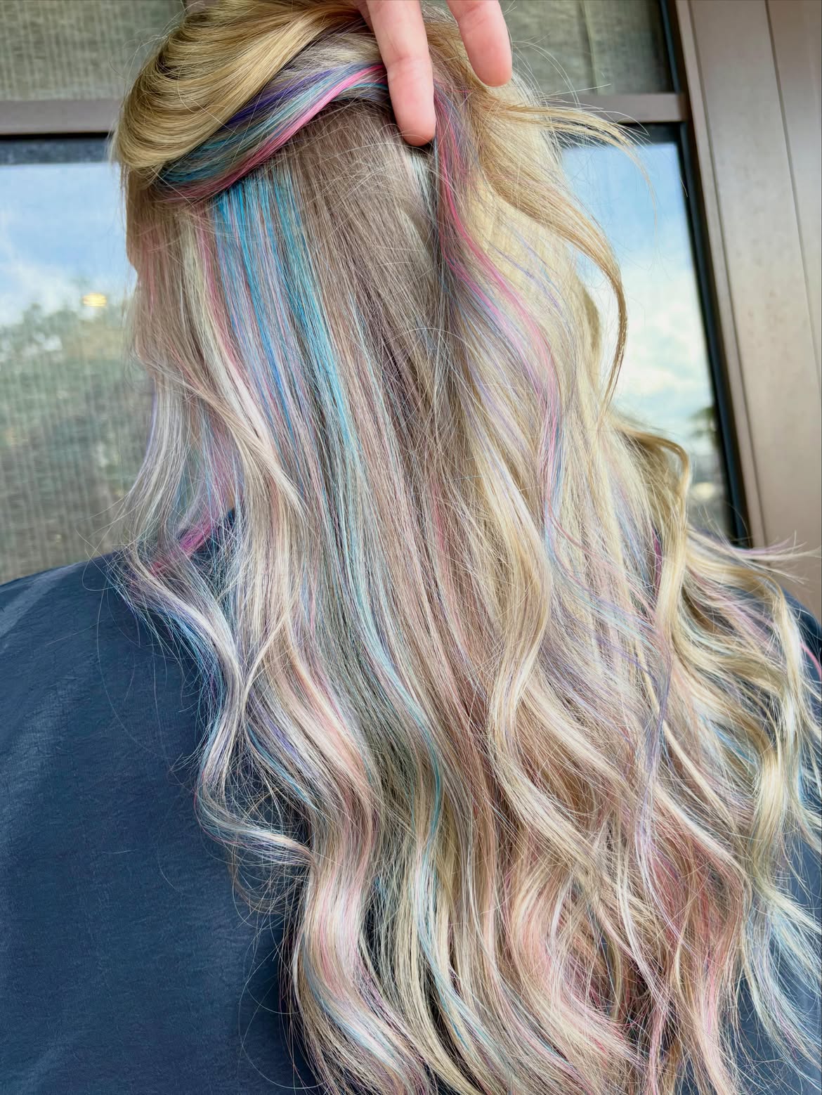 2. Hidden Pastel Mermaid Highlights on Blonde Waves