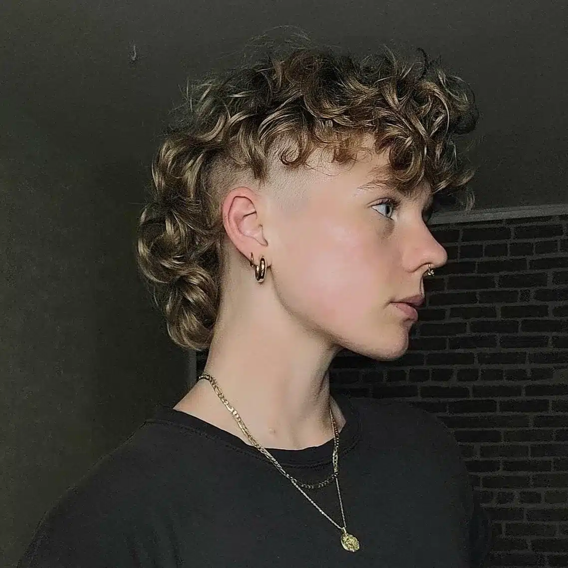 50. High-Fade Curly Mullet with Textured Fringe