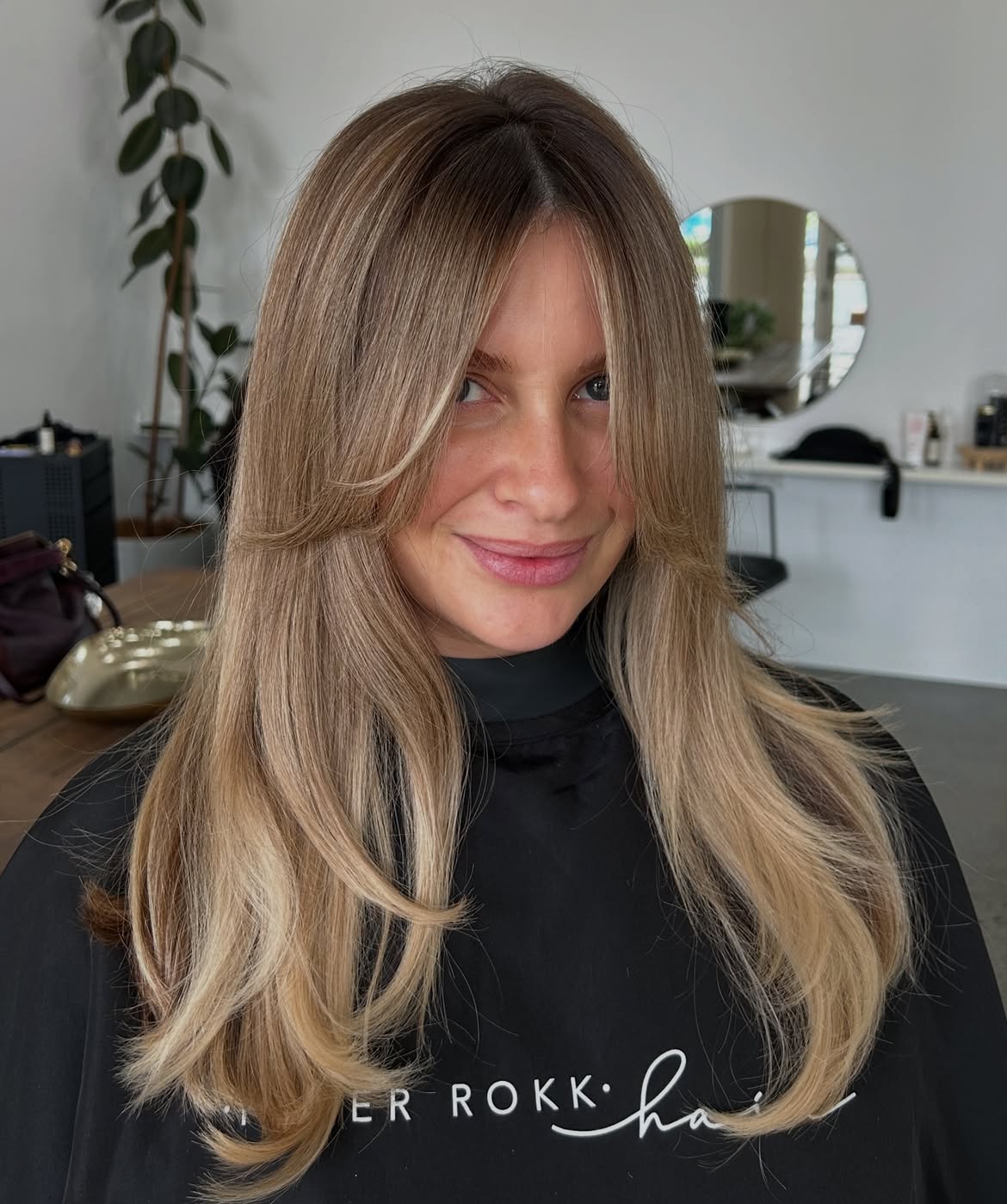 46. Honey Blonde Curtain Bangs with Long Layers