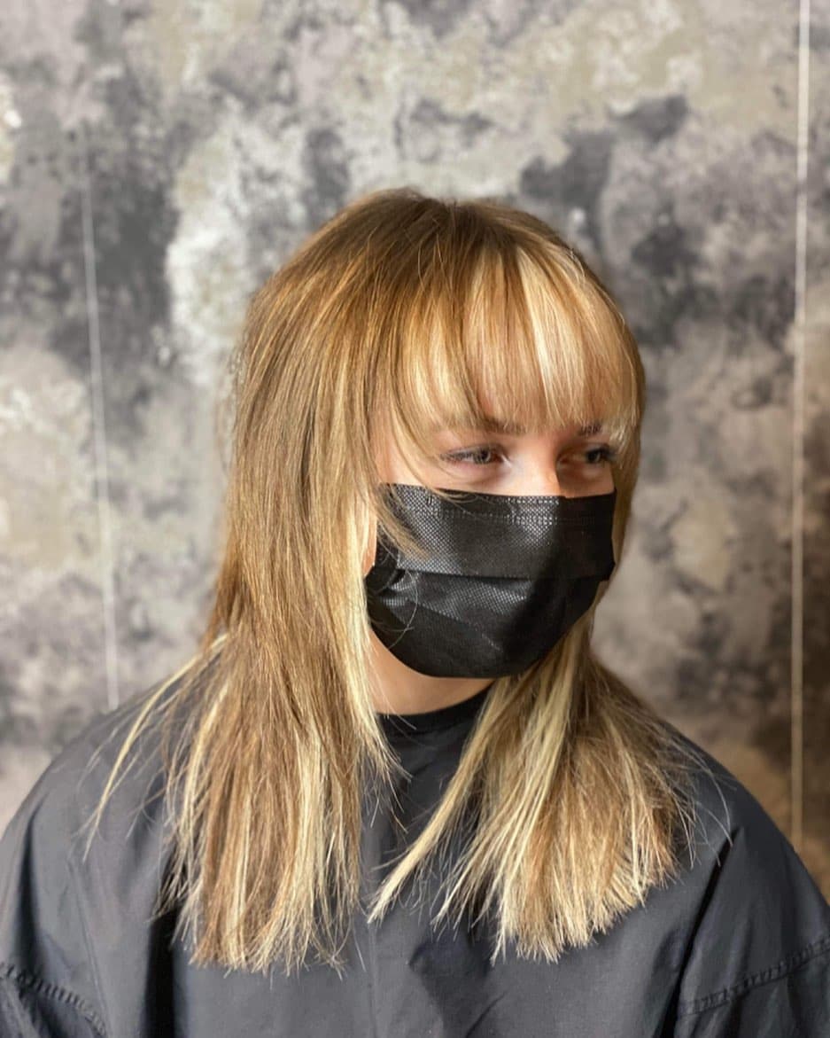 2. Honey Blonde Shag With Soft Bangs