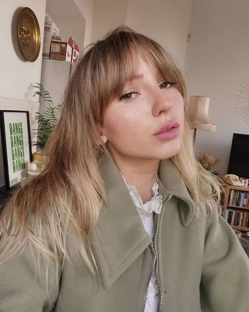 8. Honey Blonde Textured Fringe