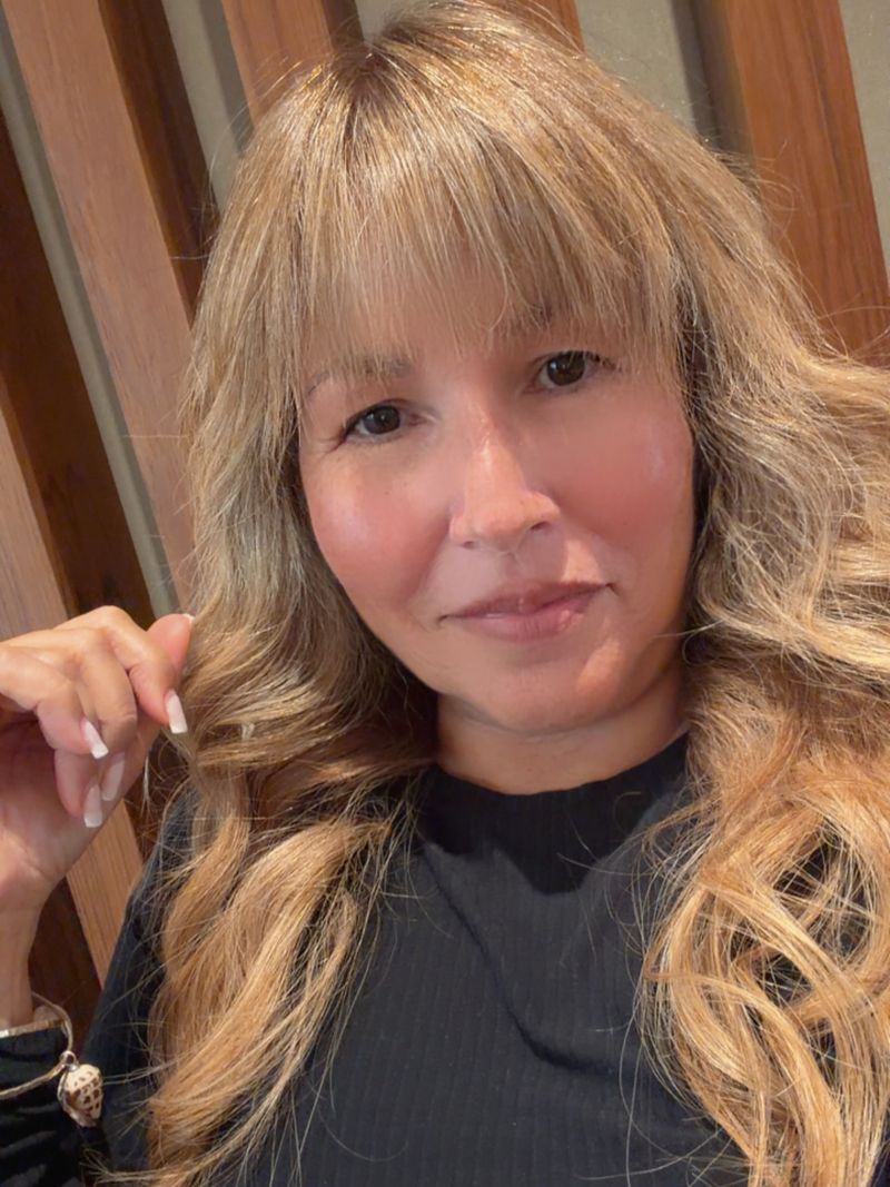 11. Honey Blonde Waves with Soft Fringe