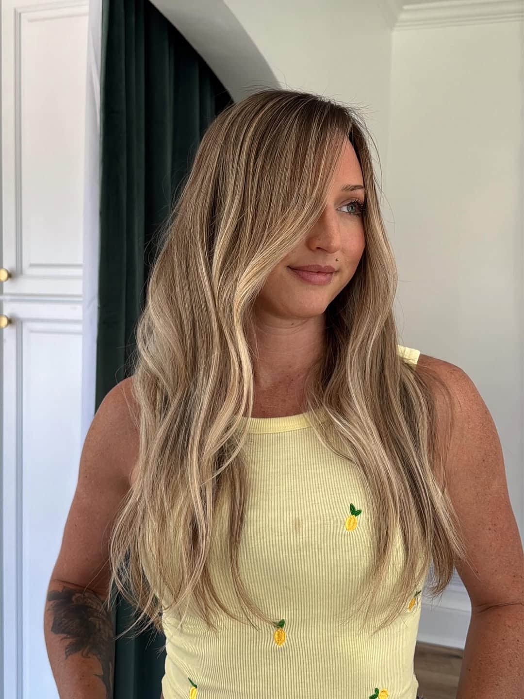 9. Honey Wheat Balayage with Deep Side Fringe
