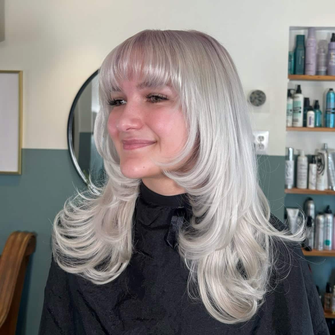9. Icy Layered Cut with Full Bangs
