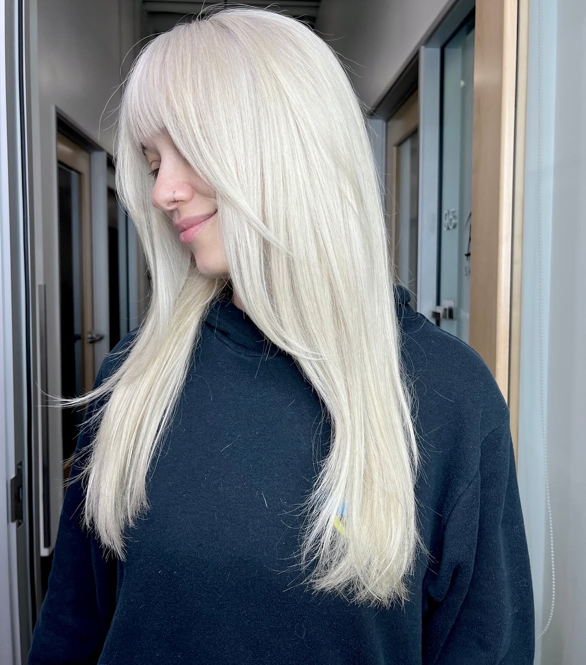 25. Icy Long Layers with Blunt Fringe