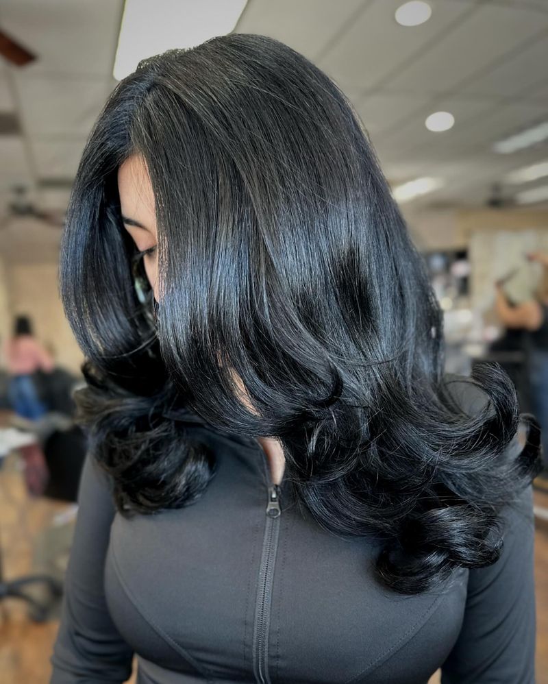 33. Inky Blue-Black Blowout With Bouncy Curls