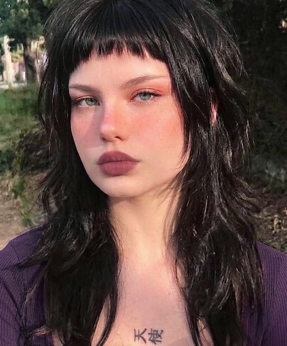 41. Jet Black Shaggy Mullet with Baby Bangs