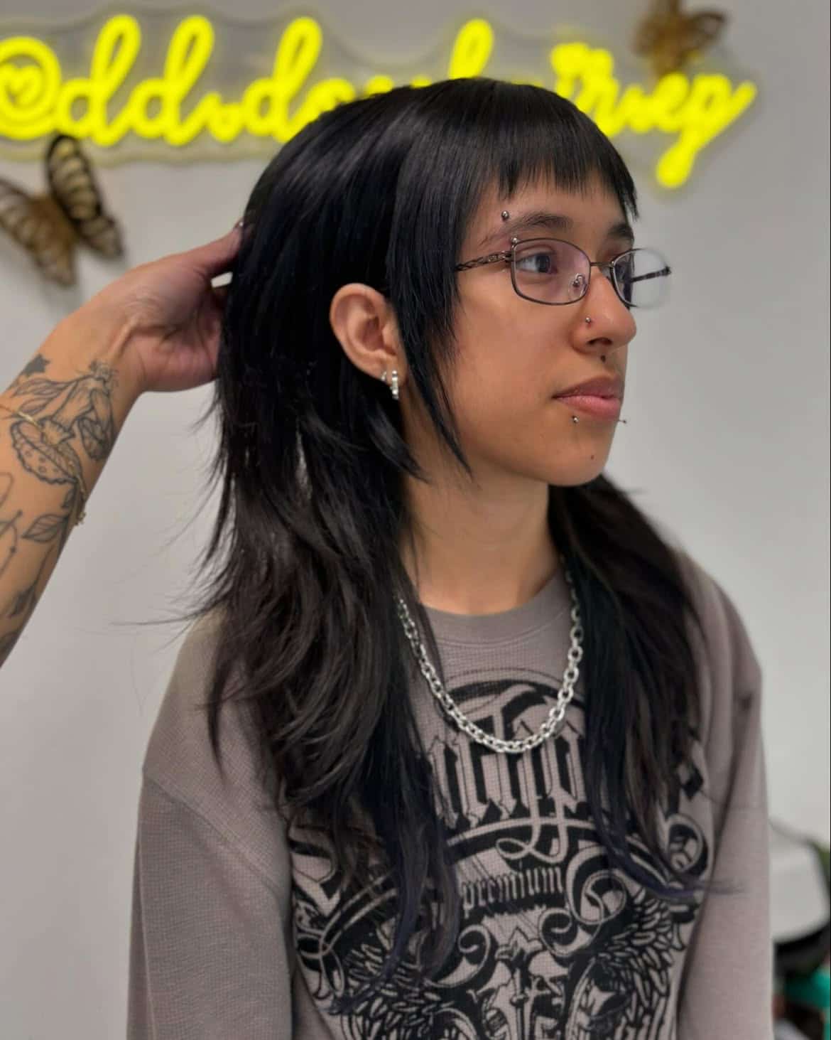 17. Jet Black Shaggy Mullet with Micro Bangs