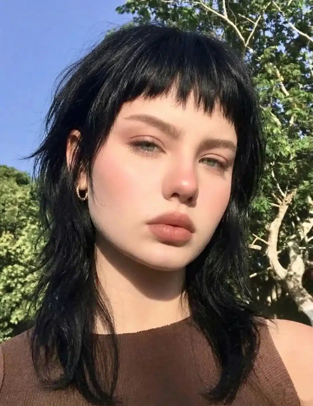 17. Jet Black Shaggy Mullet with Micro Bangs