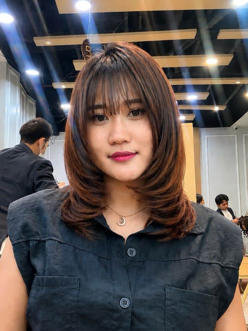 35. Layered Lob with Wispy Bangs
