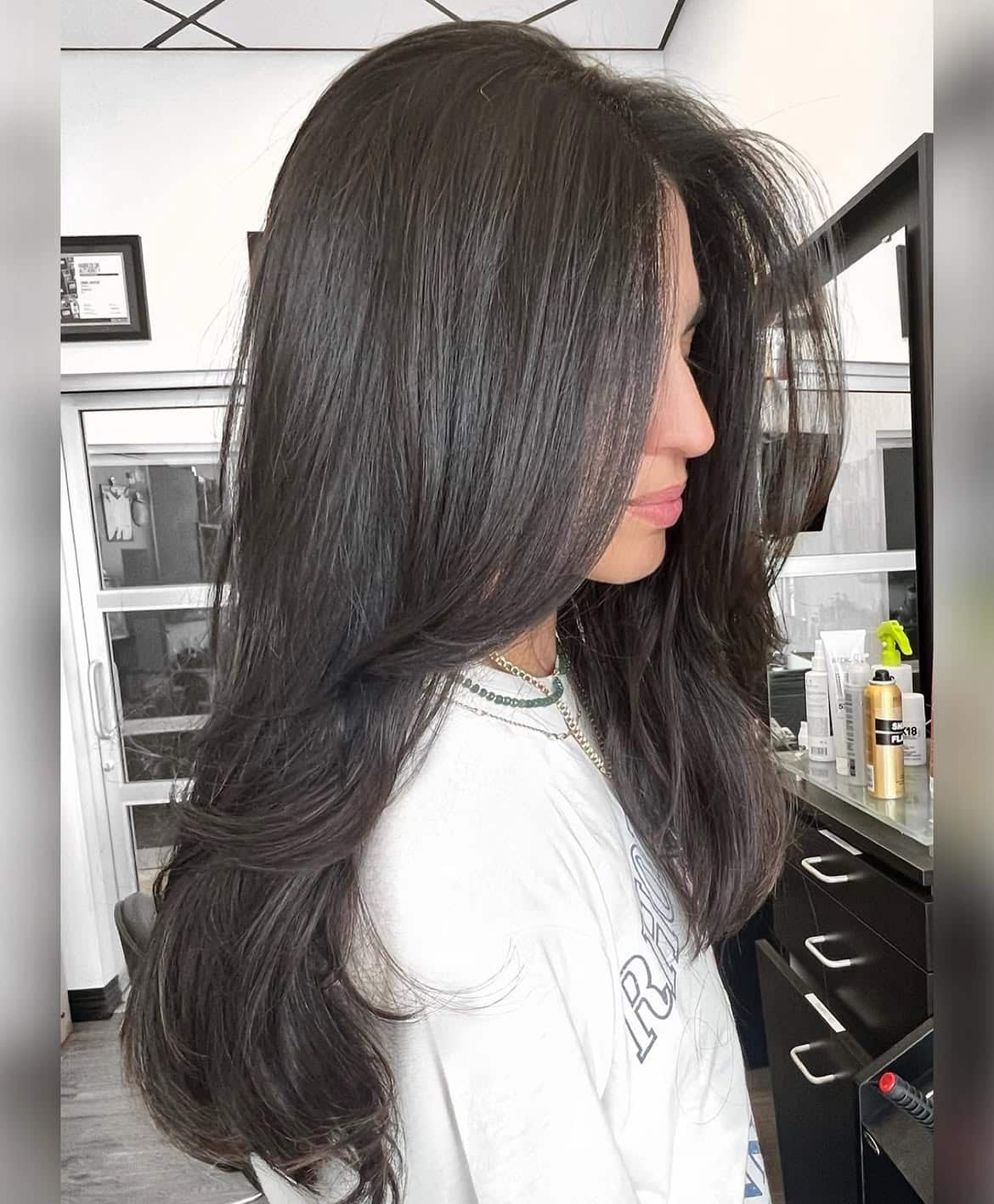 33. Long Brunette Butterfly Layers with Curtain Bangs