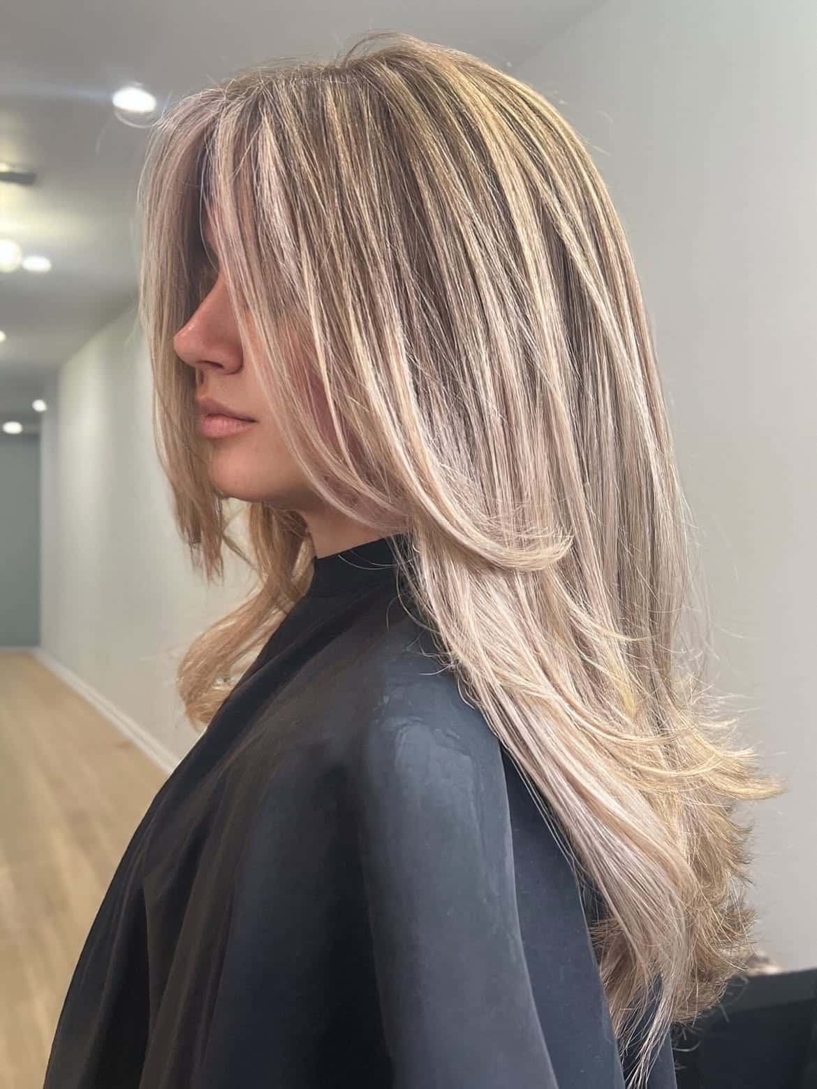 25. Long Layered Butter Blonde with Curtain Bangs