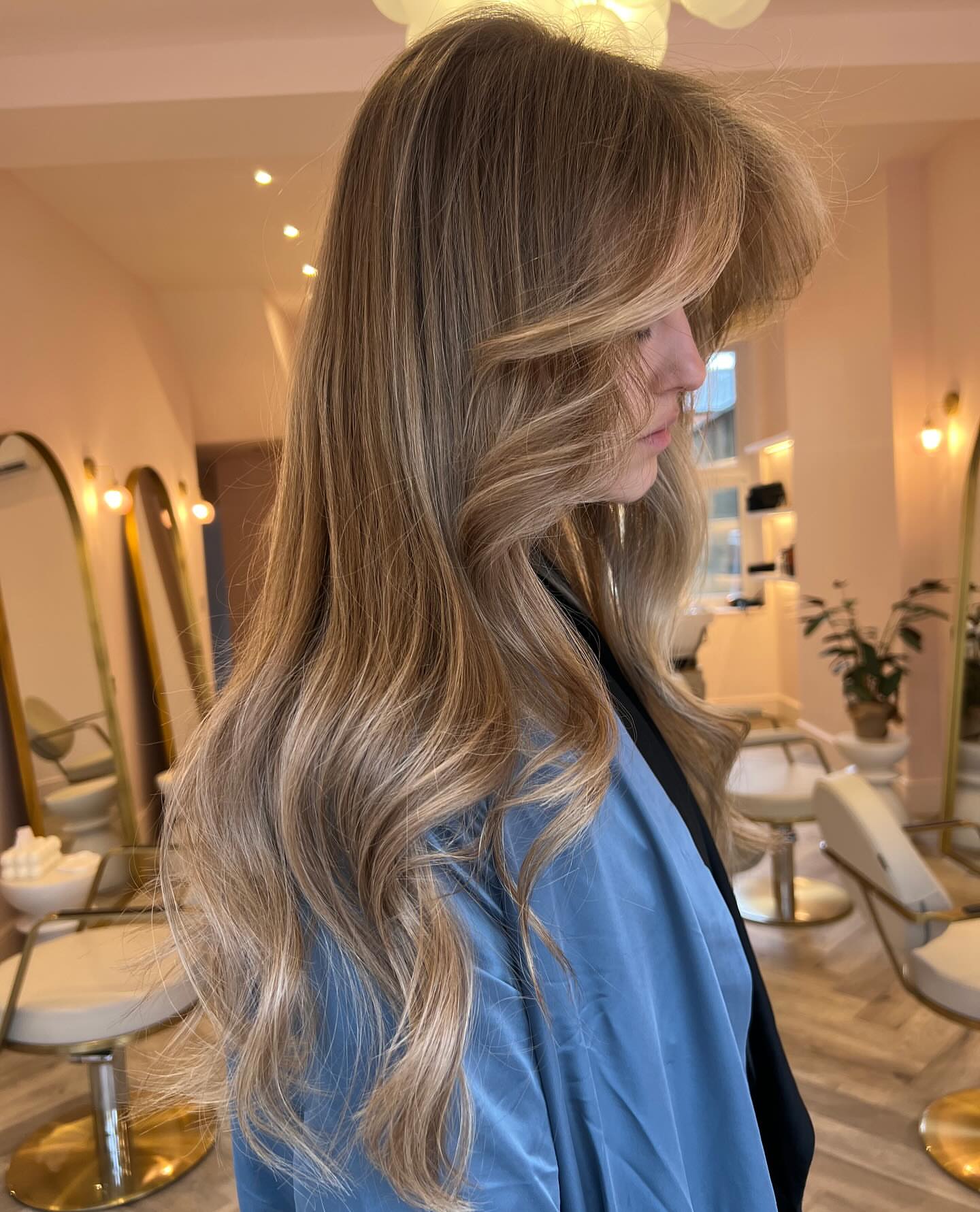 7. Long Layers with Sweeping Curtain Bangs