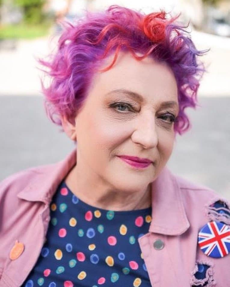 29. Magenta Curls with a Fiery Coral Pop