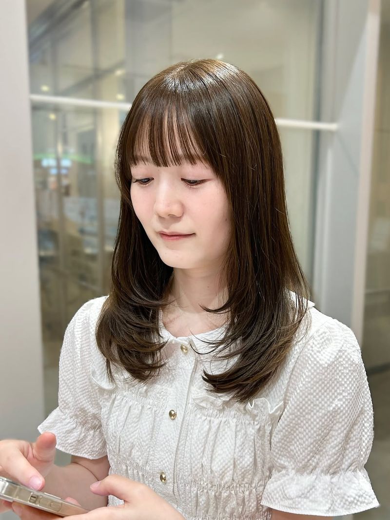 45. Medium Brown Layers with Soft Bangs