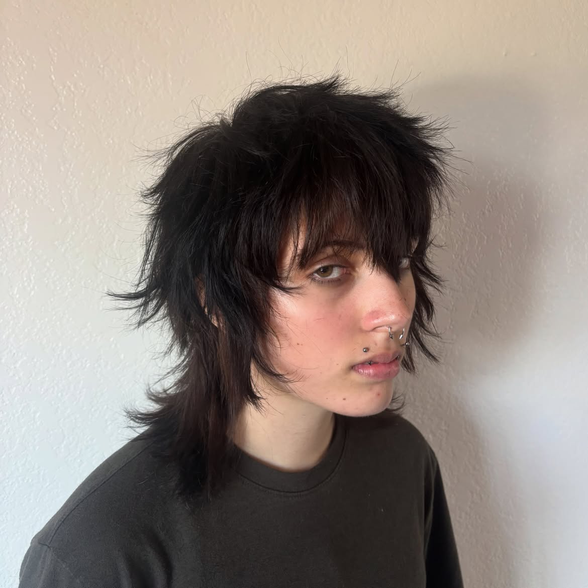 12. Messy Black Wolf Mullet with Heavy Fringe