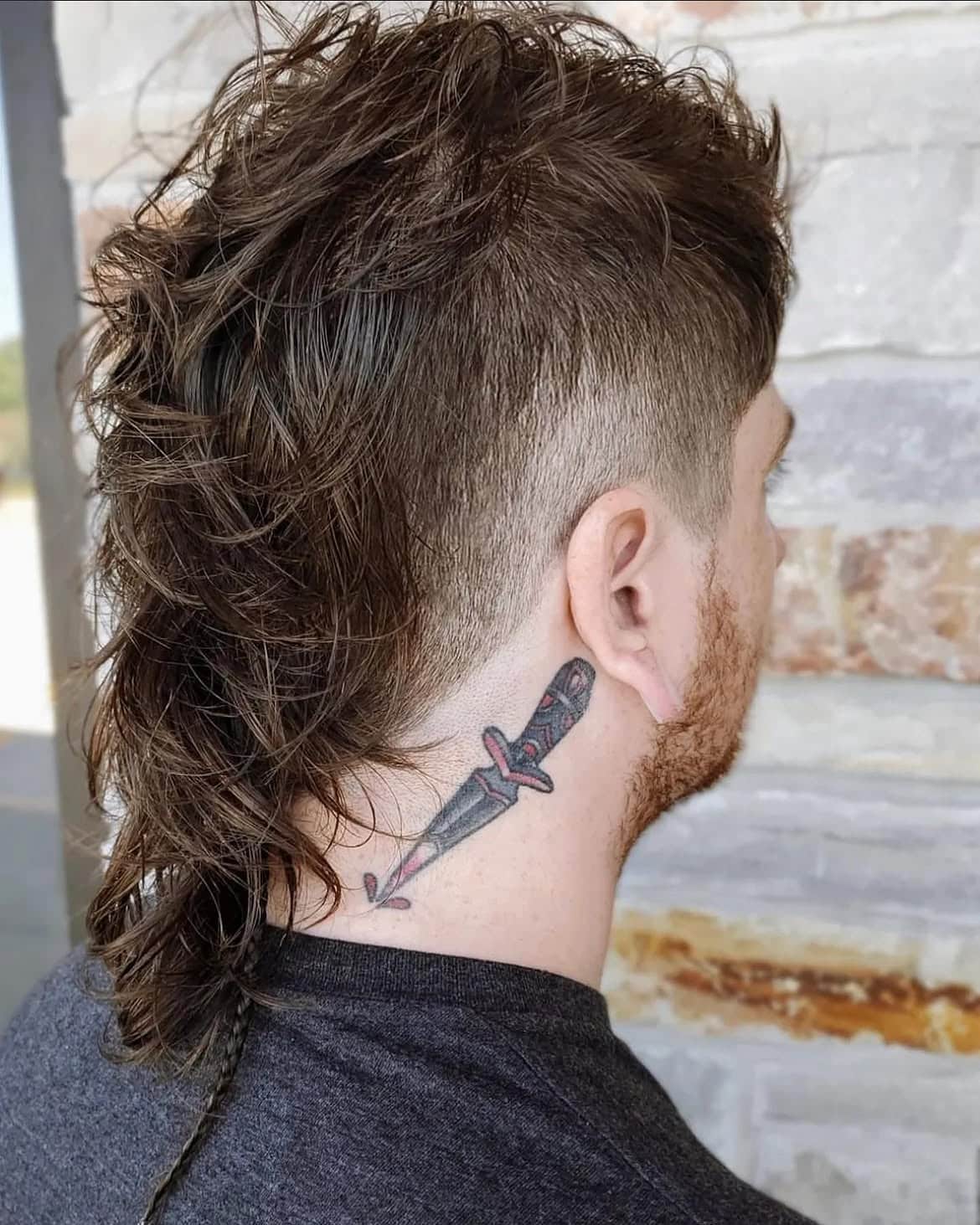 33. Messy Curly Mullet with High Taper Fade