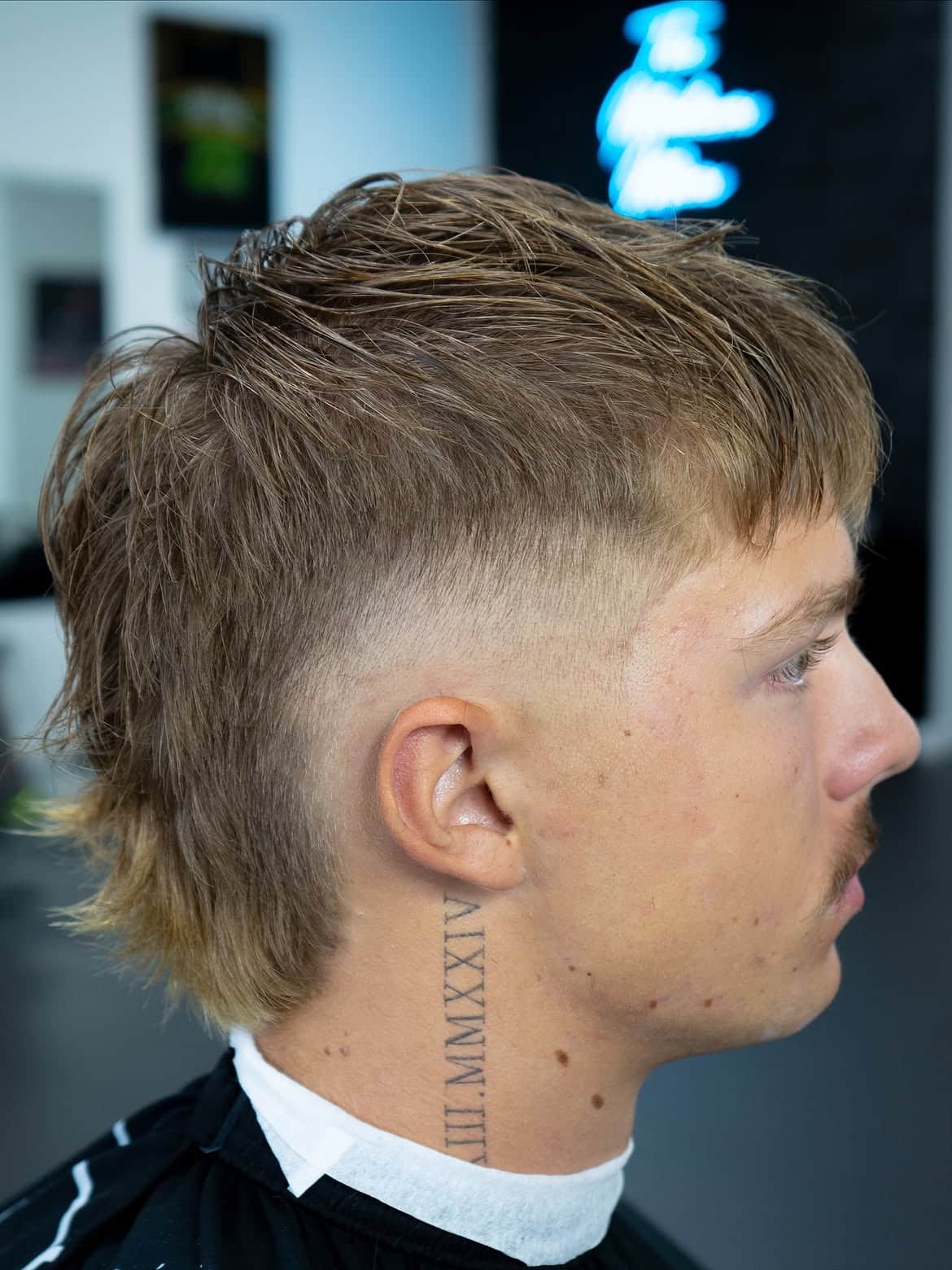 5. Messy High-Fade Mullet with Textured Fringe