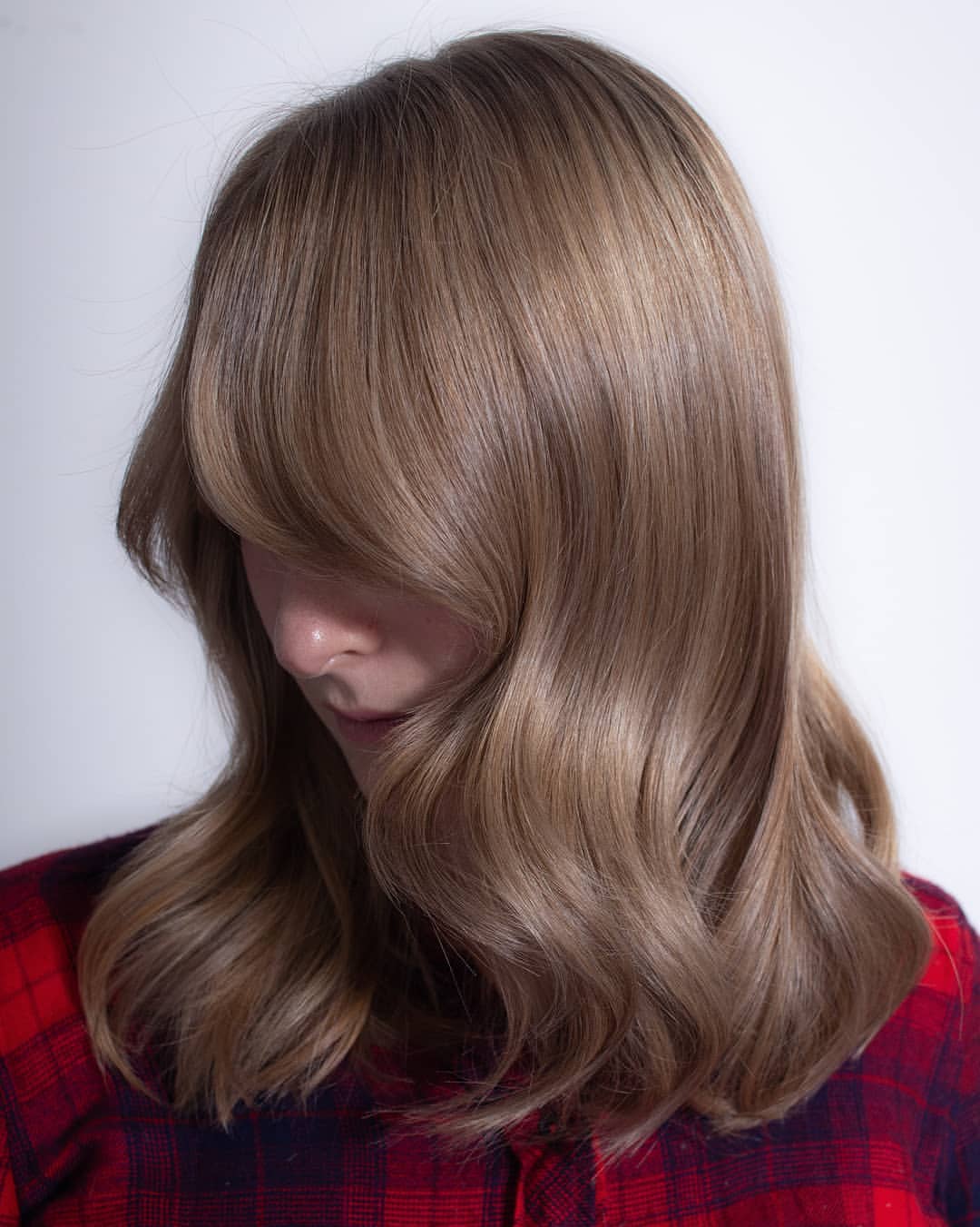 7. Mushroom Brown Blowout with Side-Swept Bangs