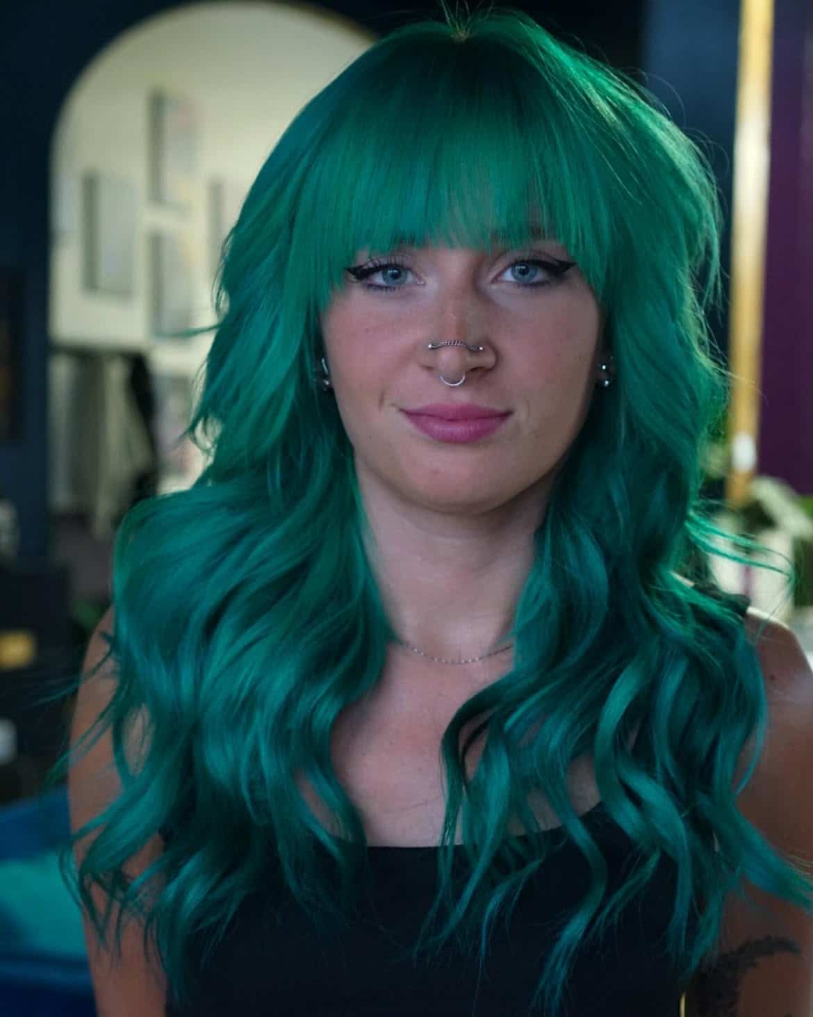 9. Neon Emerald Waves with Full Bangs
